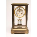 A BRASS CASED FOUR GLASS MANTEL CLOCK, the twin barrel movement with visible anchor escapement