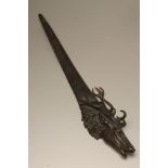 A BRONZE PAPER KNIFE, late 19th century, the handle cast as a stag's head, unsigned, 12" long (