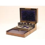 A VICTORIAN WALNUT TRAVELLING DRESSING CASE, of plain oblong form, the hinged cover with inset brass