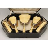 AN ART DECO SIX PIECE SILVER DRESSING TABLE SET, maker Henry Charles Dewar, Birmingham 1926, the