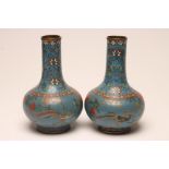 A PAIR OF CHINESE CLOISONNE ENAMEL VASES of baluster form, inlaid with cranes flying amongst peonies