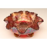 A FENTON ART GLASS CO. RED CARNIVAL GLASS BOWL, early 20th century, in the Stag and Holly pattern, 7