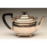 A SILVER TEAPOT, maker's mark H.A., Sheffield 1929, of canted oblong form raised upon four bun feet,