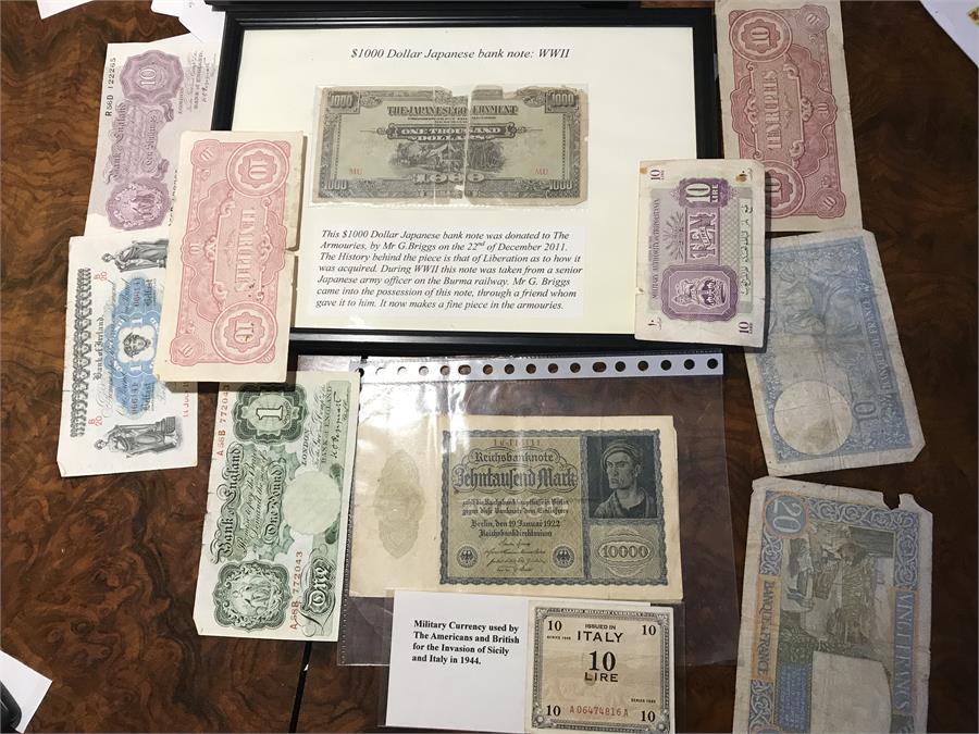 A Collection of Banknotes to Include $1000 Japanese Bank note and Military Currency.