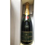 A 1990 Moet & Chandon, Brut Vintage Champagne bottle in tin.