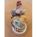 Capodimonte flower seller of lady with doves figurine.
