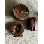 Two vintage wood fishing reels and a wood rope pulley