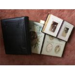 Three photograph albums and their contents