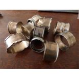 Eleven various silver napkin holders