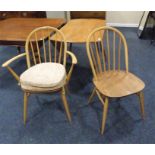 Ercol dining table, 4 dining chairs and one elbow.
