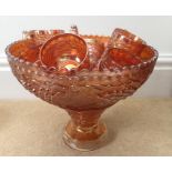 Large carnival glass punch bowl stand with 12 cups.