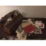 Large collection of postcards in vintage leather case