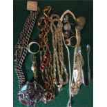 A quantity of costume jewellery to include silver watch chain, silver necklace etc.