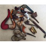 Ten various pipes and cheroot holder