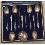 Boxed silver apostle spoons, tongs and sifter.