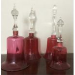 Four cranberry glass bells