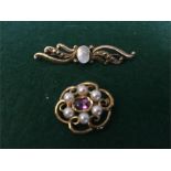 Two 9ct gold gem set brooches.