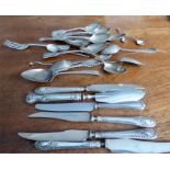 A collection of silver cutlery items