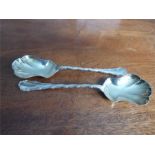 Fine quality pair of silver and guilt serving spoons