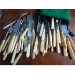 A collection of bone handled knives and forks