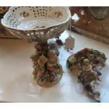 19thC porcelain bowl surrounded by putti and a 19thC porcelain wall bracket.