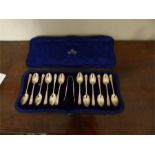 Boxed set 12 tea spoons and tongs retailed by James Ogden Harrogate Josiah Williams maker