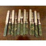Set of six silver onyx handled knives and forks 1905 Goldsmiths and Silversmiths Co Ltd.