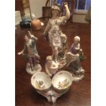 Four continental 19thC porcelain figures including salts