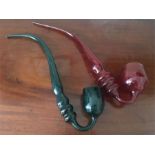 One green Nailsea glass pipe and one pink 42 cms