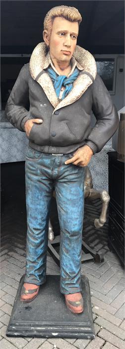 Life size figure of James Dean wearing jeans and flying jacket. Made of fibreglass on stand, approx