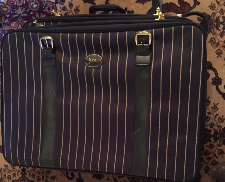 Two Antler suitcases in striped fabric.