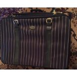 Two Antler suitcases in striped fabric.