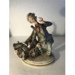 A Capodimonte figure of a man with barrow - 18cm h