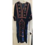 A late 1960’s velvet kaftan with embroidery and mirrors to front.