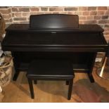 A Technics sx-px226 piano and stool