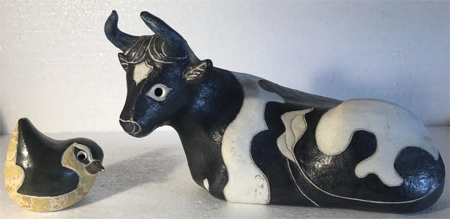 A cow and a bird pottery figures by Rosemary Wren