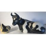 A cow and a bird pottery figures by Rosemary Wren