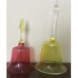 Cranberry glass bell and a lime green glass bell