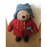 A Gabrielle Designs Paddington Bear soft toy, with label, in blue hat, red duffel coat