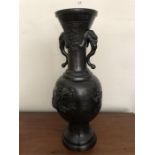 Chinese bronze vase with raised dragons etc. 46 cms h