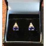 Tanzanite and diamond pierced earrings