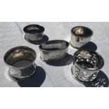 Five various silver napkin rings