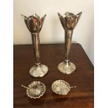 Two silver vases and a pair of shell shape salts with spoons