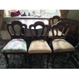 A set of four Victorian mahogany dining chairs