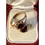Two 9ct gold and garnet rings