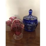 Coloured glass inc. cranberry jug and bowl, basket and a chipped blue lidded jar
