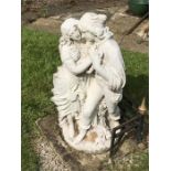 Reconstituted stone figure of a courting couple