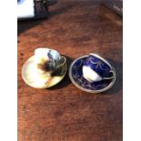 Two Royal Worcester miniature cabinet cups and saucers