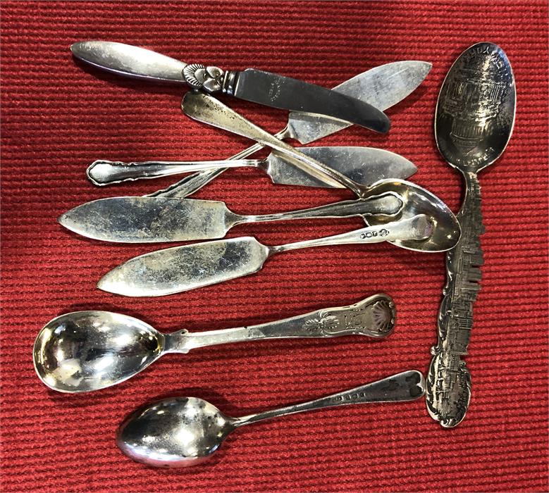 Eight silver items inc butter knives etc.