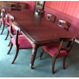 Good quality mahogany extending dining table and 8 chairs with reeded legs by John Mason of Beverley